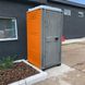 Туалетна кабіна Armal CUBE Bright Orange у використанні біля офісного приміщення