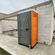 Туалетна Кабіна Armal CUBE Bright Orange у використанні під час будівництва